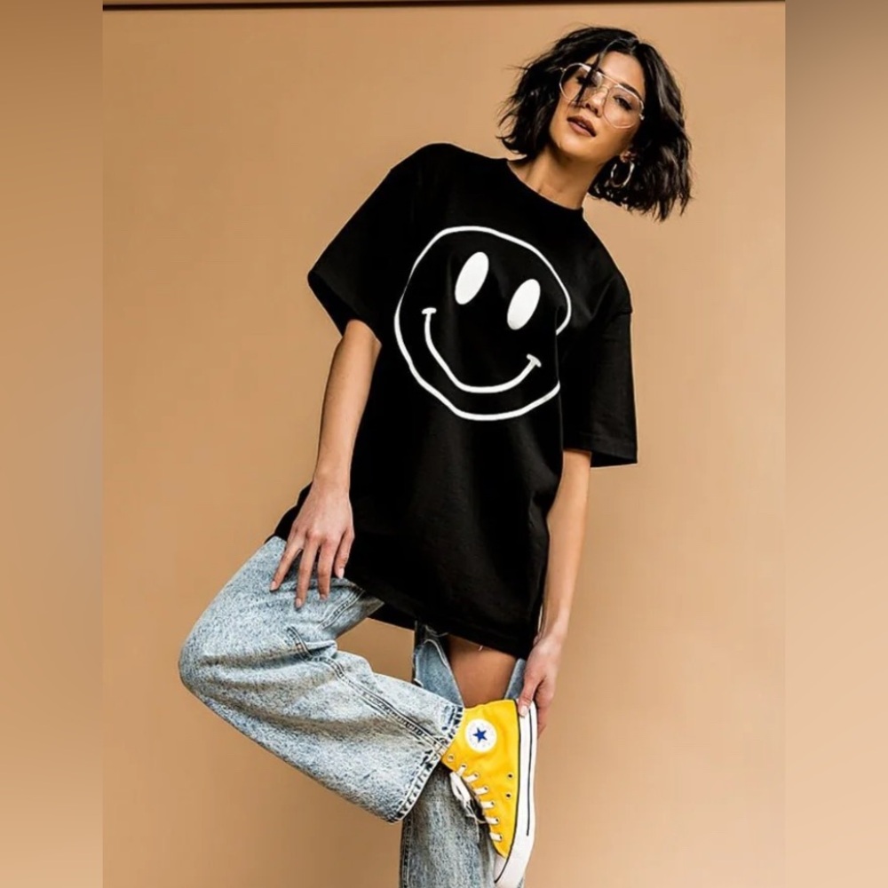 The world needs your magic oversized tee in black and white
